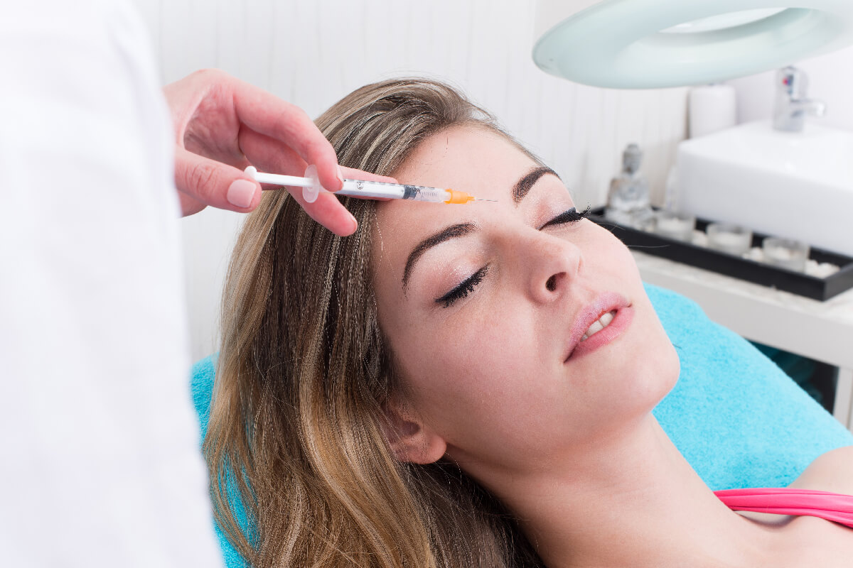 Woman getting anticellulite and anti fat therapy in beauty salon
